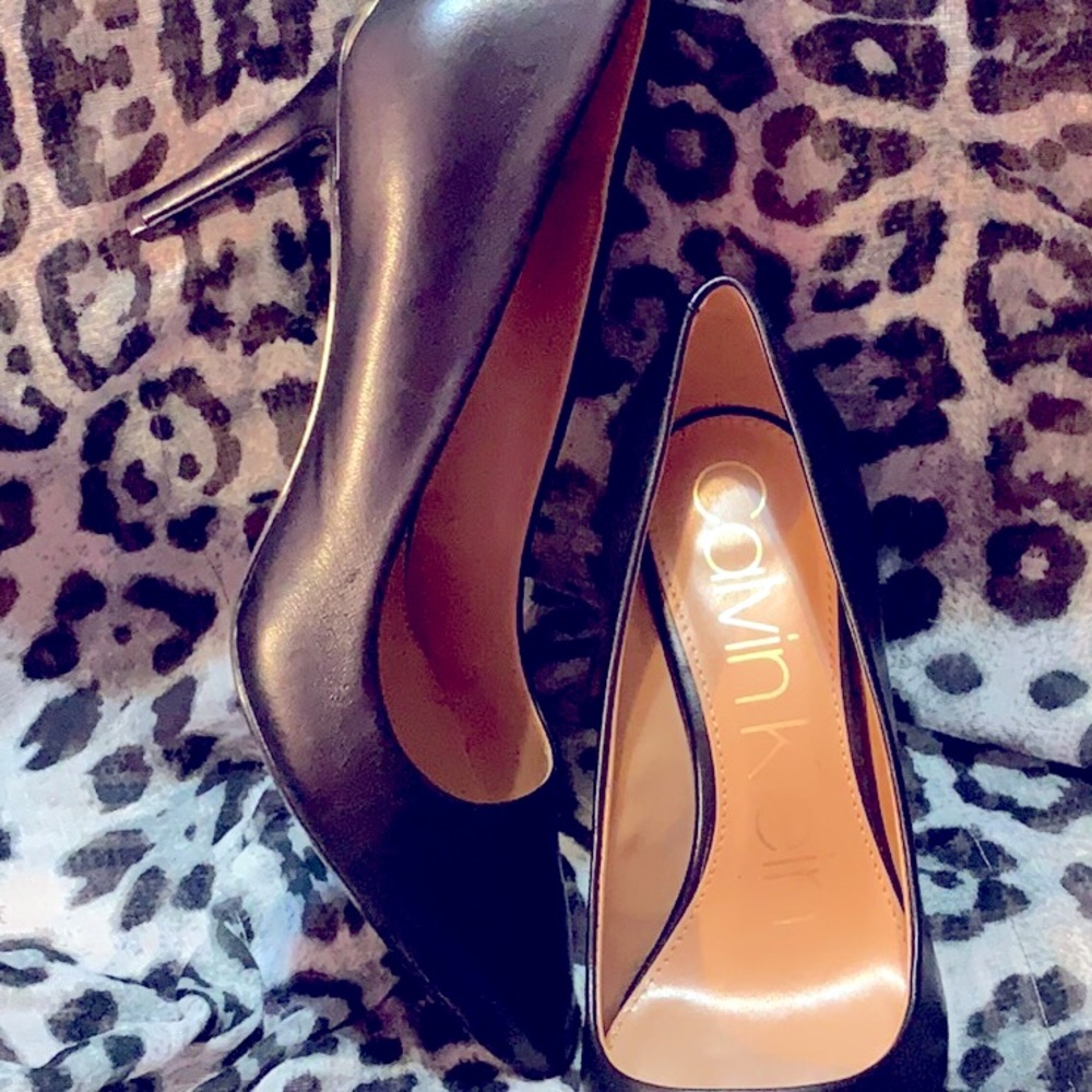 Calvin Klein 7 1/2 brand new black with gold embellishment on back heel